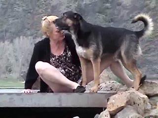 Blonde dirty MILF fucking her dog outdoor